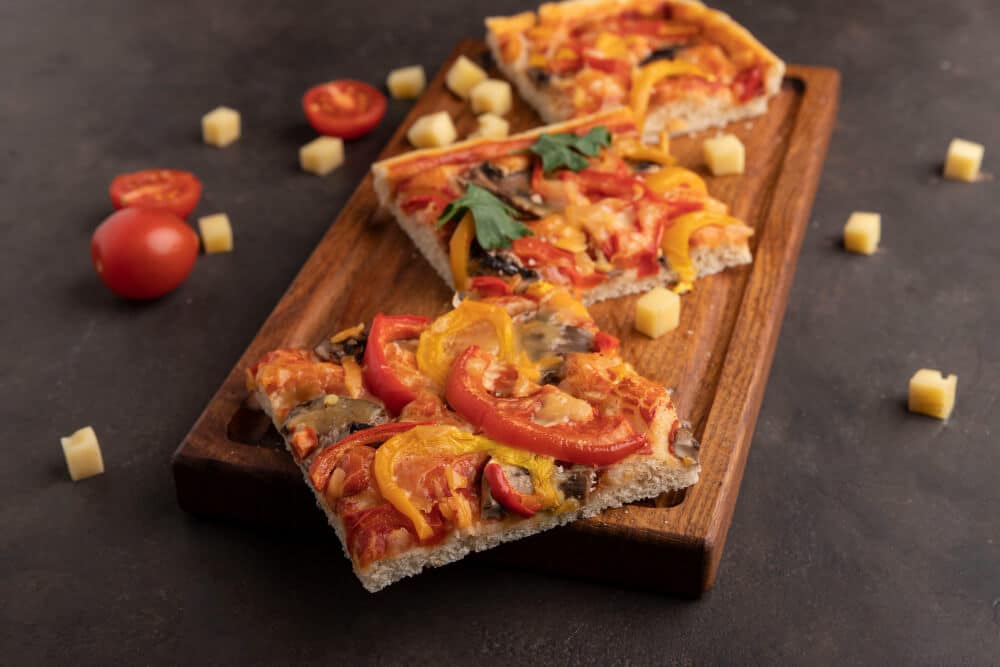 trois pizzas al taglio vue de dessus